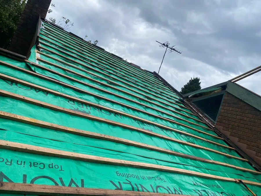 Roofer assessing a Melbourne roof to advise on restoration or replacement
