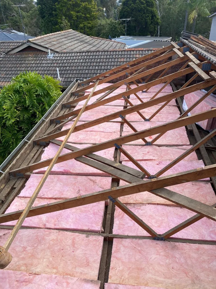 New roof tiles being installed during a roof replacement
