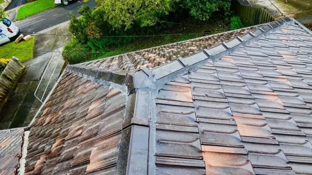 Before: moss-covered and weathered tiled roof in Melbourne