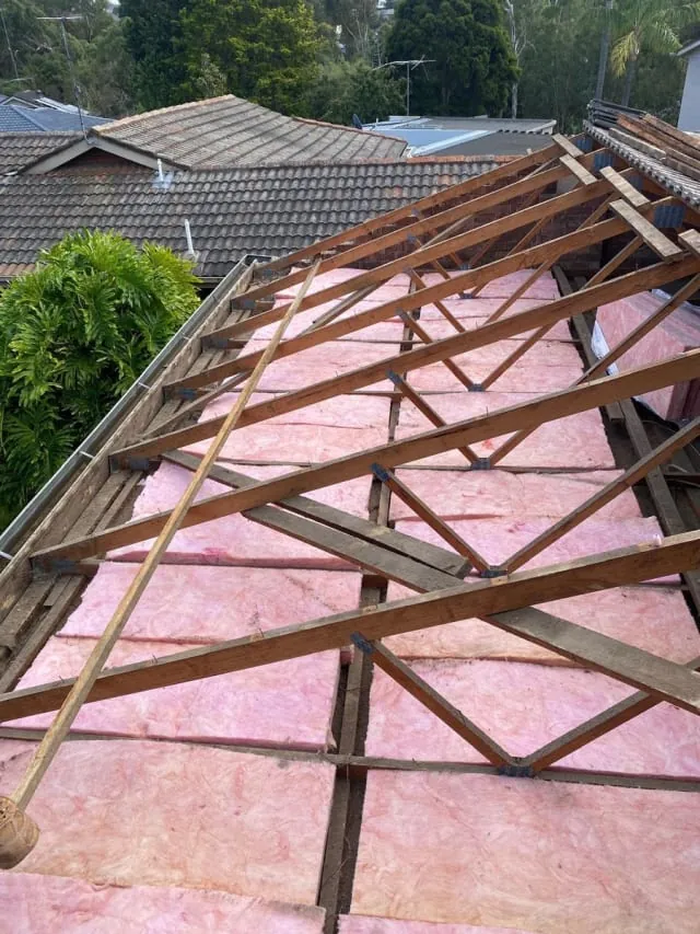Roof repair work on a pitched tiled roof in Melbourne