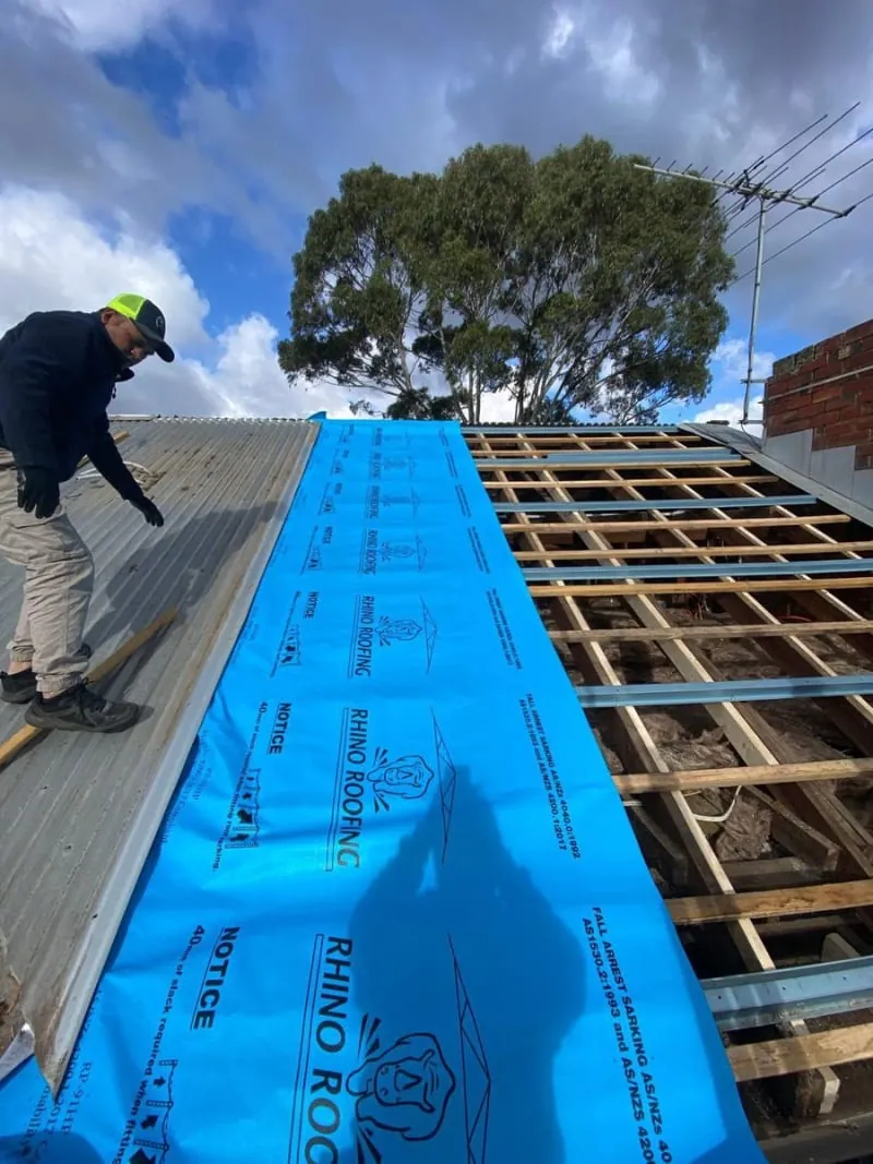 ASAP Roofing roofer working on a tiled roof in Melbourne